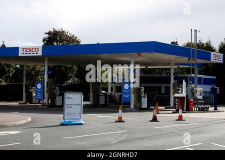 Loughborough, Leicestershire, UK. 27th September 2021.  A closed sign blocks the entrance to a Tesco petrol station after the government urged people to carry on buying petrol as normal, despite supply problems that have closed some stations. Credit Darren Staples/Alamy Live News. Stock Photo