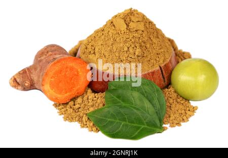 Raw turmeric, amla with henna powder and henna leaves over white background Stock Photo