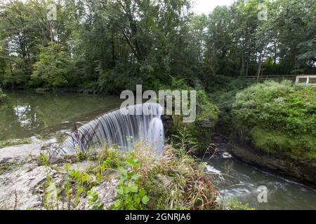 Famous beautiful Cedar Cliff Falls manmade waterfall falling down into the Massie Creek gorge Stock Photo