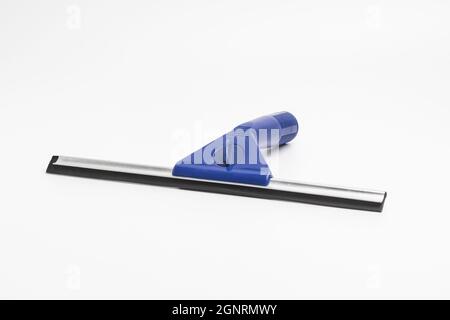 A squeegee with a blue plastic handle Stock Photo