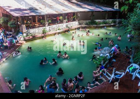 FUENTES GEORGINAS, GUATEMALA - MARCH 22, 2016: People bathing in a thermal pool Funtes Georginas. Stock Photo