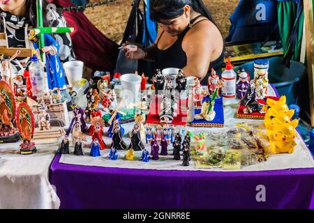 ANTIGUA, GUATEMALA - MARCH 26, 2016: Various items for sale Virgin Mary, Jesus, Pikachu on a market in Antigua Guatemala town, Guatemala. Stock Photo