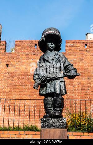 Statue of Maly Powstaniec or the Little Insurrectionist,  memorial in commemoration of the child soldiers in the old town of Warsaw, Poland Stock Photo