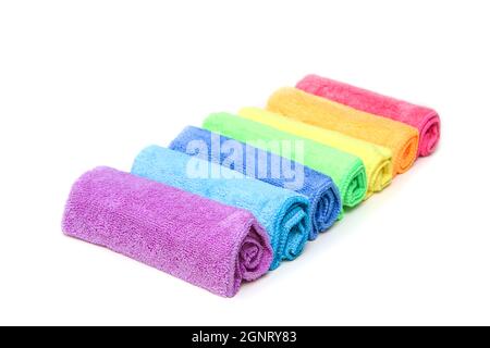 The row of the different colorful micro fibre rags ordered in a white background. Stock Photo