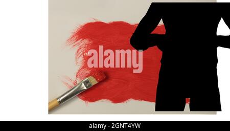 Mid section of silhouette of female handball player against red paint stain and paint brush Stock Photo