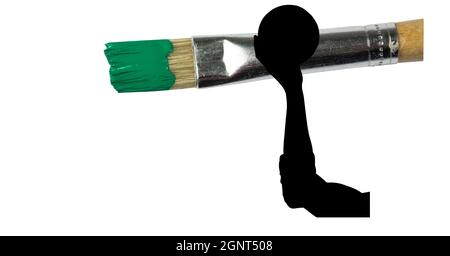 Mid section of silhouette of female handball player against paint brush with green painted tip Stock Photo