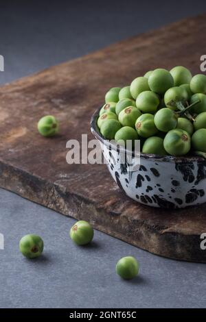 turkey berry, also called wild eggplant or pea eggplant, cup full of round vegetable Stock Photo