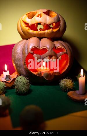 two carved pumpkins for halloween with candles. Stock Photo