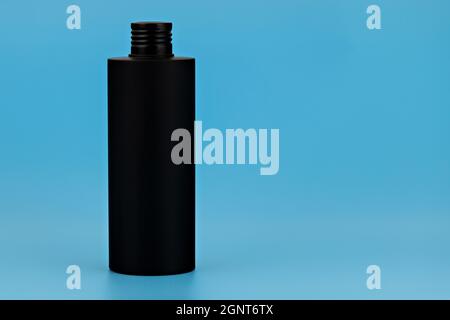 Black unbranded plastic flacon for cosmetics products. Skincare and cosmetology mockup. Branding identity template for text and design Stock Photo