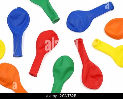 top view of deflated colorful balloons on white background Stock Photo