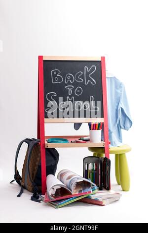 Back to school background - chalkboard, backpack and school items isolated on white background Stock Photo