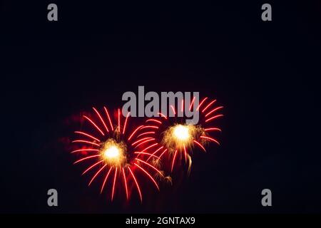colorful fireworks, gold red salute, black background, horizontal format Stock Photo