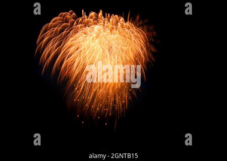 colorful fireworks, gold brocade crown, black background, horizontal format Stock Photo