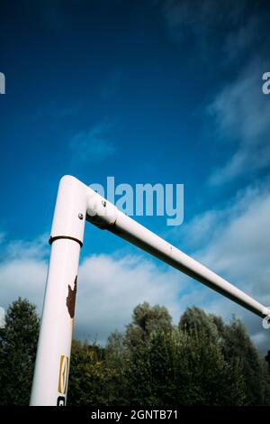 Football goal post and crossbar against blue sky Stock Photo