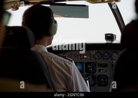 Pilots in the cockpit during a commercial flight Stock Photo