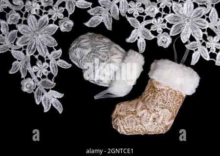 christmas toys and lace on a black background. Stock Photo