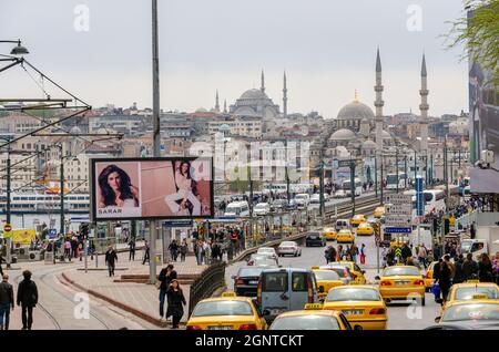 Heavy traffic on the Galata Bridge in Istanbul, Turkey against the backdrop of the city's mosques Stock Photo