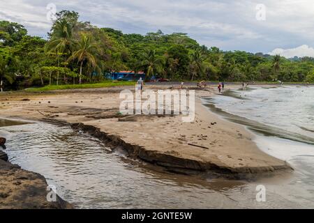 PUERTO VIEJO DE TALAMANCA, COSTA RICA  - MAY 16: People on a beach in Puerto Viejo de Talamanca village, Costa Rica Stock Photo