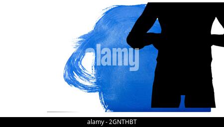 Mid section of silhouette of female handball player against blue paint brush strokes Stock Photo