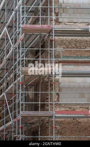 Scaffolding on the facade of a former factory Stock Photo
