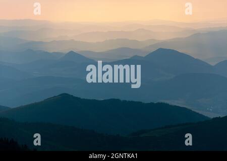 Evening colored view of blue horizons - view from Mala Fatra mountains to Beskyd or beskydy mountains - Karpathian mountains - Slovakia - Europe