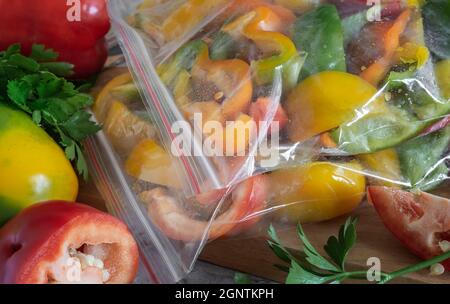 Ripe fruits of Bulgarian pepper, prepared for freezing Stock Photo