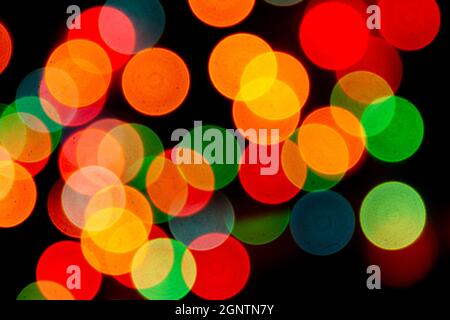 blurred defocused christmas lights bokeh on a black background Stock Photo