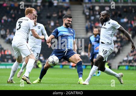 MILTON KEYNES, ENGLAND - SEPTEMBER 25, 2021: Dean Scott Lewington of Dons (L), Ryan Sirous Tafazolli of Wycombe (C) and Hiram Kojo Kwarteng Boateng of Dons (R)pictured during the 2021/22 SkyBet EFL League One matchweek 9 game between MK Dons FC and Wycombe Wanderers FC at Stadium MK. Copyright: Cosmin Iftode/Picstaff Stock Photo