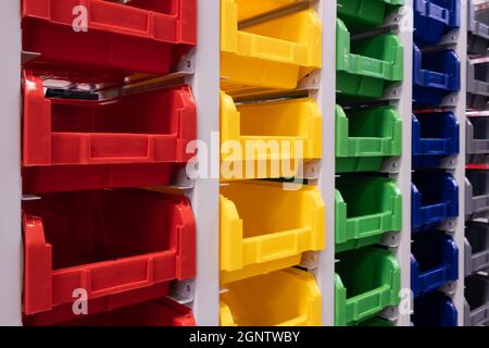 rows of multicolored plastic boxes for components Stock Photo