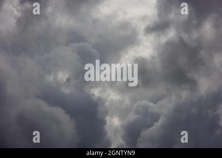 grey incoming storm clouds full frame background Stock Photo