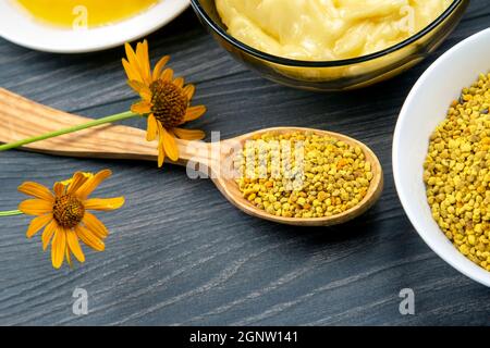 Fresh flower honey of different varieties, pollen with spoons on a wooden background. Organic Vitamin Health Food Stock Photo