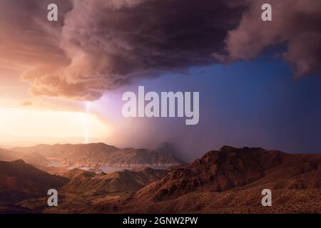 Lake Mead National Recreation Area with lightning storm and dramatic sky at sunset near Meadview, Arizona Stock Photo