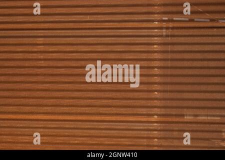 Perforated Rusty Corrugated Wall Background image Stock Photo
