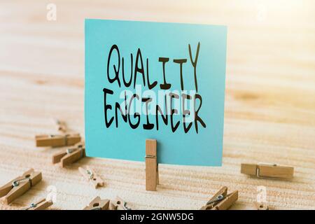 Text caption presenting Quality Engineer. Conceptual photo ensure the overall quality of a manufactured product Piece Of Blank Square Note Surrounded Stock Photo