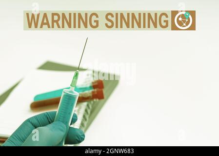 Text sign showing Warning Sinning. Business showcase stop the action which is believed to break the laws Writing Important Medical Notes Laboratory Stock Photo