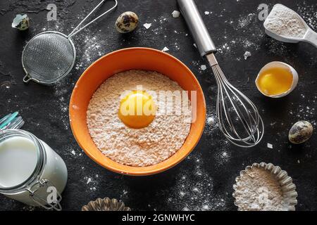 ingredients and utensils for baking on black background Stock Photo