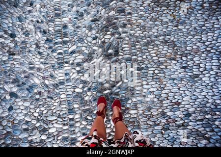 Pebble road in the city center. Mosaic in Rhodes Stock Photo