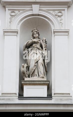 Saint Catherine of Alexandria statue on the facade of St. Catherine church in Zagreb, Croatia Stock Photo