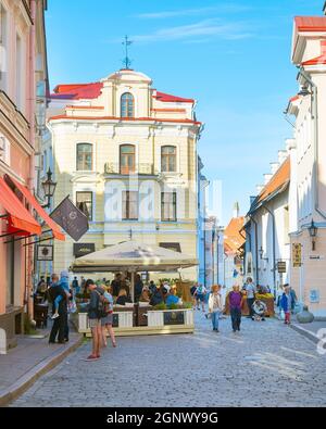 TALLINN, ESTONIA - JULY 14, 2019: Tourists walking by the street at Old Town of Tallinn. Stock Photo