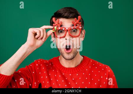 Photo portrait man wearing funny glasses stare amazed shocked excited isolated green color background Stock Photo
