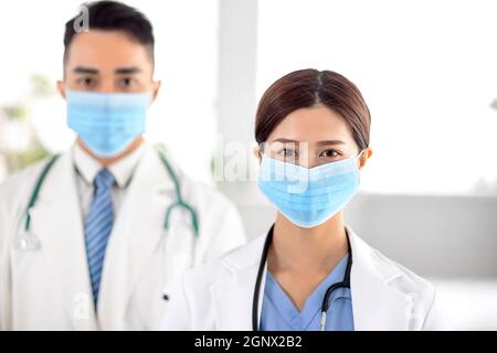 doctors faces wearing protective mask in Hospital Stock Photo