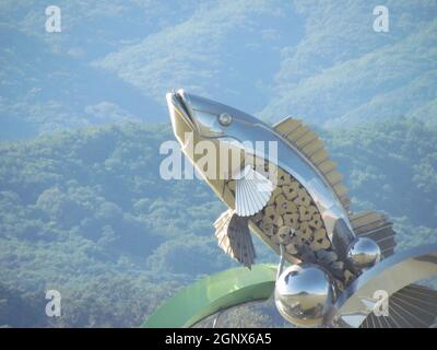Chuncheon, South Korea- 19th Sep, 2020: The Statue of fish in middle of Soyanggang or soyang river with blue sky