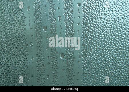 Bright grey color glassy texture, with water drops on it. Water drop glassy background Stock Photo