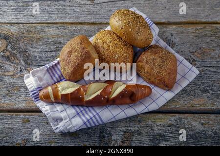 bread on kitchen towel on a rustic wooden background Stock Photo