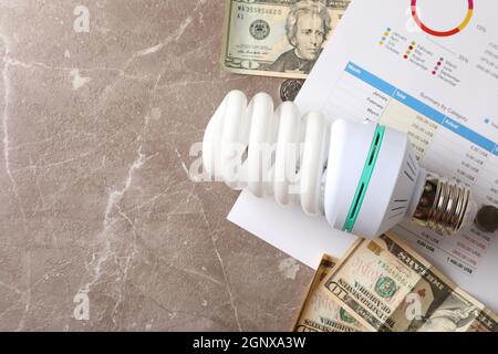 Energy saving concept on gray textured background. Stock Photo