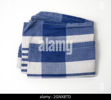 folded white cotton fabric with blue stripes on white background, top view Stock Photo