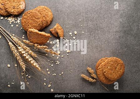 Homemade cereal oatmeal cookies on grey table background. Healthy Food Snack Concept. Copy space Stock Photo