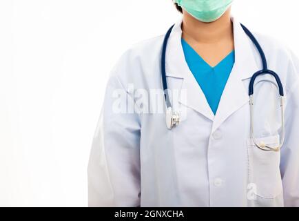 A confident female nurse standing with stethoscope, woman doctor in white uniform, studio shot isolated on over white background, medical health conce Stock Photo