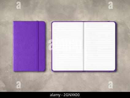 Purple closed and open lined notebooks mockup isolated on concrete background Stock Photo
