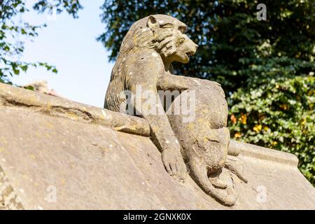 Baboon monkey sculpture from the Animal Wall of Cardiff Castle in Wales built in 1890 in Castle Street which is a popular travel destination tourist a Stock Photo